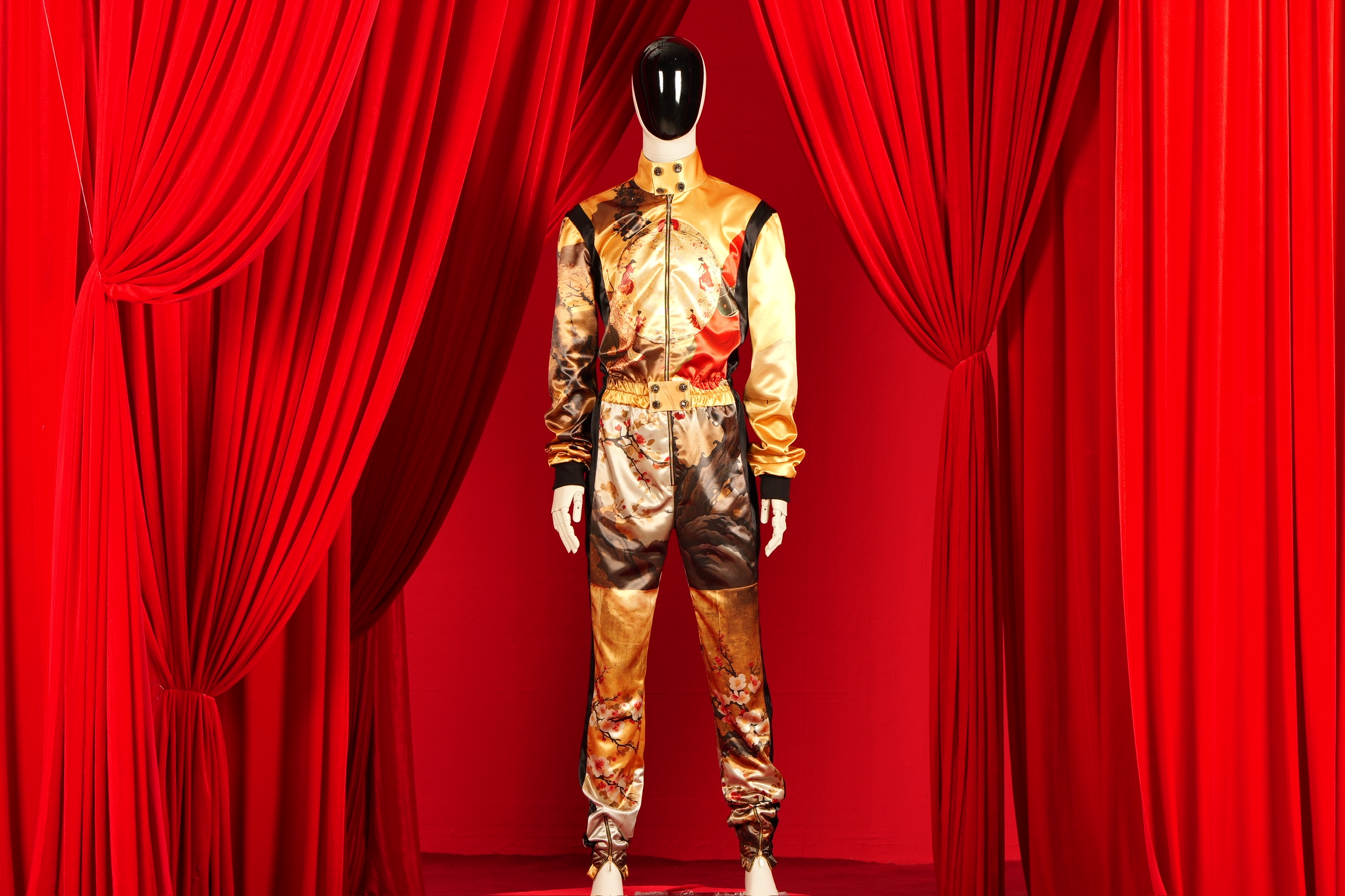 AURUM alternate view: gold satin suit with hand-embellished woodblock print